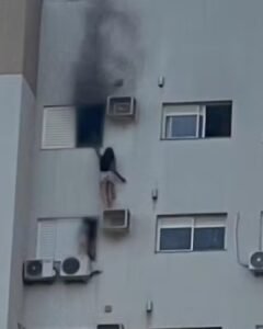 Mulher fica pendurada em suporte de ar-condicionado para salvar mãe e primo durante incêndio no Paraná
